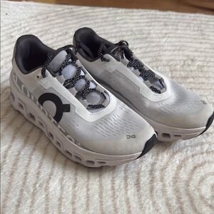 On Running White and Black Athletic Shoes